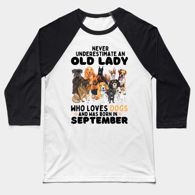 Never Underestimate An Old Lady Who Loves Dogs And Was September Baseball T-Shirt by JustBeSatisfied